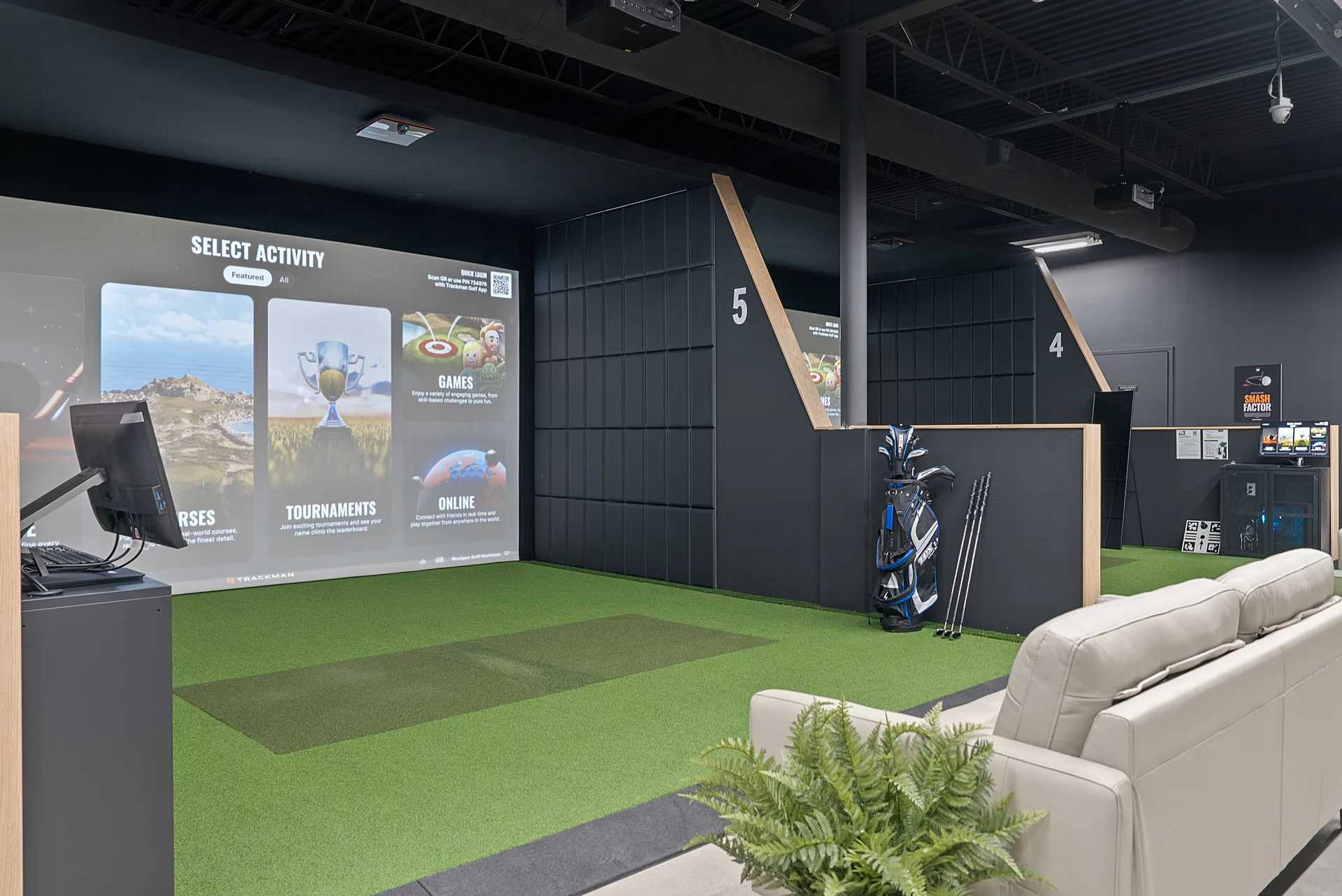 Bay 5 and the cream sofa at Shotgun Golf Markham with the TrackMan menu on the screen